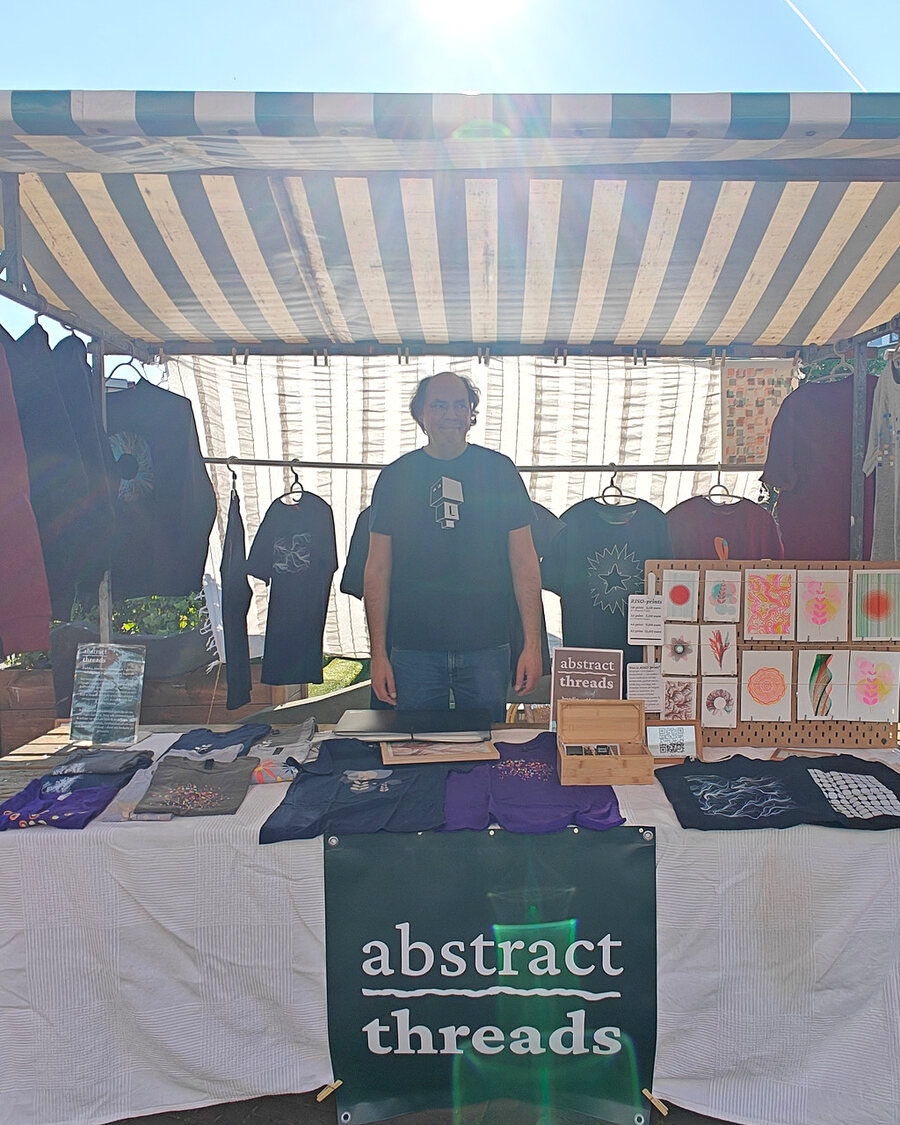 Machiel behind the Abstract Threads market stall in Utrecht